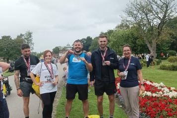 Some of Healthwatch lining up for a photoshoot after the 10k