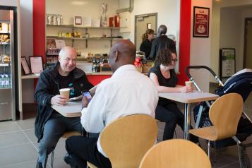 Men talking in cafe