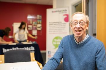 gentleman smiling for a photo at a healthwatch event