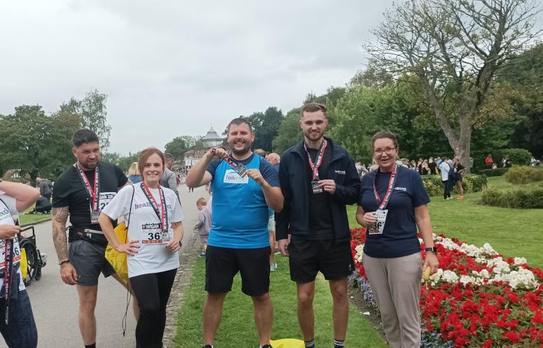 Some of Healthwatch lining up for a photoshoot after the 10k